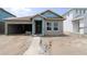An unfinished single-story home featuring a two-car garage and visible building materials at 10648 Crescent Creek Xing, Parrish, FL 34219