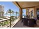 This balcony boasts panoramic ocean views and features a dining table, ideal for outdoor entertaining at 11 Baymont St # 505, Clearwater Beach, FL 33767