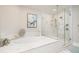 Elegant bathroom with soaking tub and frameless glass shower at 11 Baymont St # 505, Clearwater Beach, FL 33767