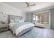 Bright bedroom features plush bedding, elegant decor, and beautiful beach view from the window at 11 Baymont St # 505, Clearwater Beach, FL 33767
