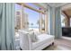 Bedroom view featuring beach view, chaise lounge and drapes at 11 Baymont St # 505, Clearwater Beach, FL 33767
