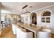 Well-appointed dining room with large table, chandelier, and custom built-in cabinetry at 11 Baymont St # 505, Clearwater Beach, FL 33767