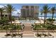 Beautiful beachfront condo building with luxurious pool area and tropical landscaping at 11 Baymont St # 505, Clearwater Beach, FL 33767
