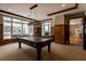 Well-lit game room with a pool table and large windows overlooking the beach at 11 Baymont St # 505, Clearwater Beach, FL 33767