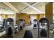 Well-equipped gym with modern weight machines, mirrors, and striped carpet flooring at 11 Baymont St # 505, Clearwater Beach, FL 33767