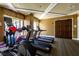 Community gym featuring modern treadmills, elliptical machine, and fitness balls near a window at 11 Baymont St # 505, Clearwater Beach, FL 33767