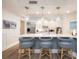 Updated kitchen with a large island, pendant lighting, and stainless steel appliances at 11 Baymont St # 505, Clearwater Beach, FL 33767