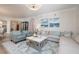 Spacious living area features stylish furniture, a cozy sectional, and an open layout for easy flow at 11 Baymont St # 505, Clearwater Beach, FL 33767