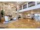 Beautiful open lobby with marble accent wall, fireplace, seating, chandelier, and upper level view at 11 Baymont St # 505, Clearwater Beach, FL 33767