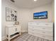Modern sitting room with built-in storage and mounted TV at 11 Baymont St # 505, Clearwater Beach, FL 33767