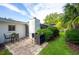 Private brick patio perfect for outdoor dining and relaxation with lush green surroundings at 11322 Carrollwood Dr, Tampa, FL 33618
