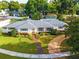 Beautifully landscaped one-story home with a well-maintained lawn and charming curb appeal at 11322 Carrollwood Dr, Tampa, FL 33618