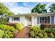 Inviting home facade with a meticulously landscaped garden and neutral tones at 11322 Carrollwood Dr, Tampa, FL 33618