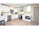 Bright kitchen featuring stainless steel appliances, modern white cabinets and quartz countertops at 11322 Carrollwood Dr, Tampa, FL 33618