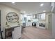 Modern kitchen with white cabinets, stainless steel appliances and a stylish wine rack feature at 11322 Carrollwood Dr, Tampa, FL 33618