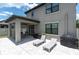 Backyard patio with lounge chairs, outdoor grill, and plenty of space for entertaining at 12382 Tibbetts St, Odessa, FL 33556
