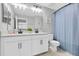 Well-lit bathroom with a double vanity, modern fixtures, and stylish decor at 12382 Tibbetts St, Odessa, FL 33556