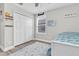 This bedroom features minimalist decor, ample closet space, and natural light at 12382 Tibbetts St, Odessa, FL 33556
