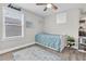 Bright bedroom with ample natural light, minimalist decor, and a cozy rug at 12382 Tibbetts St, Odessa, FL 33556