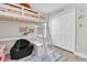 bedroom featuring a loft bed, study area, and plenty of closet space at 12382 Tibbetts St, Odessa, FL 33556