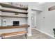 Hallway with built-in desk and shelves providing a quiet workspace at 12382 Tibbetts St, Odessa, FL 33556