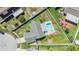 Aerial view of home, showcasing a private backyard with a pool, spa, and patio area at 1304 Cedar Ct, Tarpon Springs, FL 34689