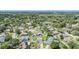 Bird's eye view of homes in a tranquil neighborhood with lush trees and serene water features at 1304 Cedar Ct, Tarpon Springs, FL 34689