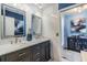 Stylish bathroom featuring a double vanity with modern fixtures and a walk-in shower at 1304 Cedar Ct, Tarpon Springs, FL 34689