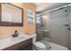 Updated bathroom with a tiled shower, new vanity, and modern fixtures at 1304 Cedar Ct, Tarpon Springs, FL 34689