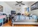 Bright bedroom with wood floors, ceiling fan, and modern furnishings at 1304 Cedar Ct, Tarpon Springs, FL 34689