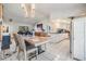 Bright dining area with a modern chandelier and a view into the living room and kitchen at 1304 Cedar Ct, Tarpon Springs, FL 34689