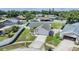 Charming single-story home with well-maintained landscaping, driveway, and fenced yard at 1304 Cedar Ct, Tarpon Springs, FL 34689