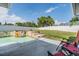 Spacious backyard with pool, patio, and green space, great for outdoor enjoyment at 1304 Cedar Ct, Tarpon Springs, FL 34689
