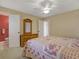 Bedroom featuring a cozy bed, closet and access to the ensuite bathroom at 13186 Linden Place Dr, Seminole, FL 33776