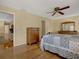 Bright bedroom featuring wood floors, traditional furniture, and ample natural light at 13186 Linden Place Dr, Seminole, FL 33776