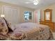 Bedroom featuring a cozy bed, closet and natural lighting at 13186 Linden Place Dr, Seminole, FL 33776