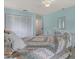 Cozy bedroom with closet and a white iron bed frame, and neutral walls at 13186 Linden Place Dr, Seminole, FL 33776