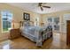 Comfortable bedroom with a ceiling fan, natural light, and a classic style at 13186 Linden Place Dr, Seminole, FL 33776