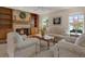 Spacious living room featuring a fireplace, built-in shelves, and lots of natural light at 13186 Linden Place Dr, Seminole, FL 33776