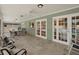 Spacious sunroom with tiled flooring, fan and lots of natural light, perfect for relaxation and entertainment at 13186 Linden Place Dr, Seminole, FL 33776