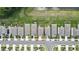 Aerial view showcasing the location of the property within a neighborhood and its proximity to nearby amenities and green spaces at 13648 Whiskey Daisy Dr, Dade City, FL 33525