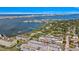 Aerial view showcases the condo's waterfront location and the beautiful surrounding neighborhood at 139 Bluff View Dr # 405, Belleair Bluffs, FL 33770