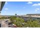 Scenic view of building with parking and community waterfront access at 139 Bluff View Dr # 405, Belleair Bluffs, FL 33770