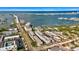 Scenic aerial view of waterfront condos, a bridge, and a calm bay with sailboats at 139 Bluff View Dr # 405, Belleair Bluffs, FL 33770