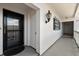 Apartment entrance with door, lighting, and railing at 139 Bluff View Dr # 405, Belleair Bluffs, FL 33770