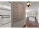 Inviting foyer with hardwood floors and view of the kitchen, living, and balcony at 139 Bluff View Dr # 405, Belleair Bluffs, FL 33770