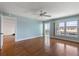 Spacious living room bathed in natural light with hardwood flooring and balcony access at 139 Bluff View Dr # 405, Belleair Bluffs, FL 33770