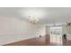 Spacious living room with hard wood floors, elegant chandelier and lots of natural light at 139 Bluff View Dr # 405, Belleair Bluffs, FL 33770