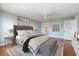 Comfortable main bedroom featuring natural light, ceiling fan, and ensuite bathroom access at 139 Bluff View Dr # 405, Belleair Bluffs, FL 33770