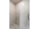 A close-up view of the shower featuring a modern marble tile design and a glass enclosure at 139 Bluff View Dr # 405, Belleair Bluffs, FL 33770